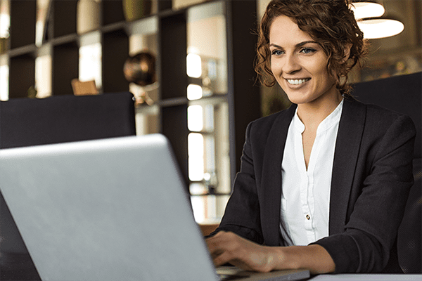 Woman sitting in front of laptop