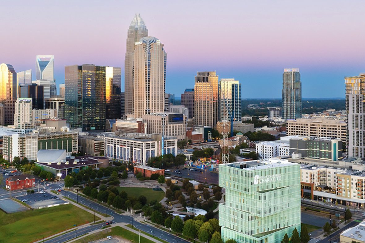 Charlotte city skyline with sunset in the background.
